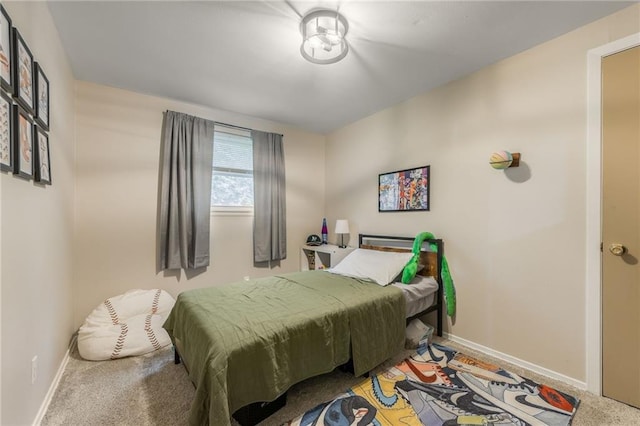 bedroom featuring carpet floors and baseboards