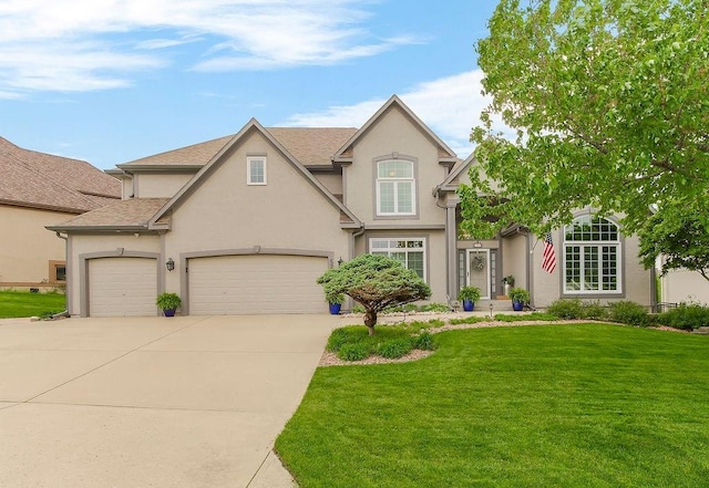 view of front of property featuring roof with shingles, a front lawn, a garage, stucco siding, and concrete driveway