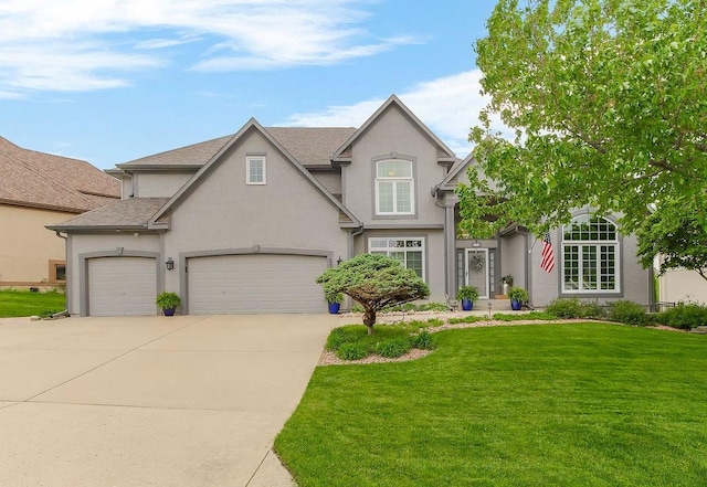 5720 NE Quartz Dr, Lees Summit, MO 64064 - traditional-style house featuring roof with shingles, a garage, stucco siding, a front yard, and driveway