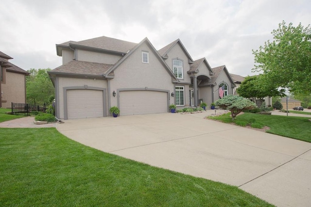 5720 NE Quartz Dr, Lees Summit, MO 64064 - french country inspired facade with concrete driveway, a garage, a front yard, and stucco siding