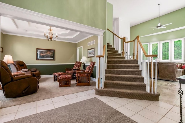 5720 NE Quartz Dr, Lees Summit, MO 64064 - staircase featuring crown molding, carpet floors, tile patterned floors, ceiling fan with notable chandelier, and visible vents