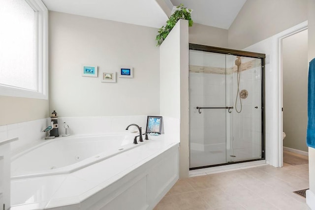 5720 NE Quartz Dr, Lees Summit, MO 64064 - bathroom with a whirlpool tub, tile patterned floors, a stall shower, and a healthy amount of sunlight