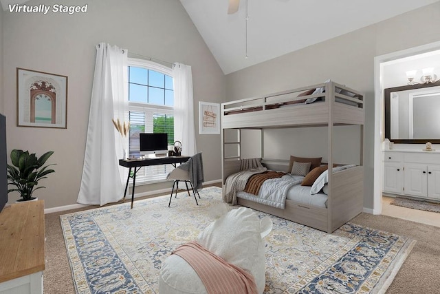 5720 NE Quartz Dr, Lees Summit, MO 64064 - bedroom featuring baseboards, ensuite bathroom, light carpet, and high vaulted ceiling