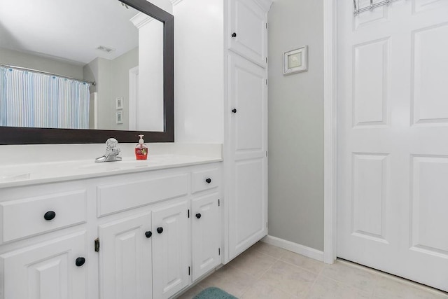 5720 NE Quartz Dr, Lees Summit, MO 64064 - full bath with tile patterned floors, visible vents, baseboards, and vanity