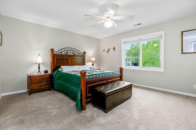 5720 NE Quartz Dr, Lees Summit, MO 64064 - bedroom with light colored carpet, baseboards, visible vents, and ceiling fan