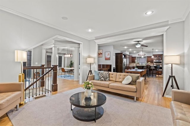 12544 Grand Ct, Kansas City, MO 64145 - living room with a ceiling fan, crown molding, light wood finished floors, and recessed lighting