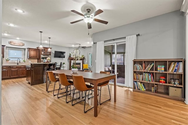 12544 Grand Ct, Kansas City, MO 64145 - dining space featuring a ceiling fan, light wood finished floors, and recessed lighting