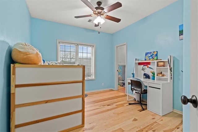 12544 Grand Ct, Kansas City, MO 64145 - office area featuring baseboards, light wood-style floors, and ceiling fan
