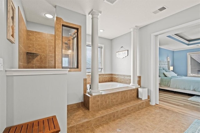 12544 Grand Ct, Kansas City, MO 64145 - ensuite bathroom with a garden tub, ensuite bathroom, visible vents, a walk in shower, and ornate columns