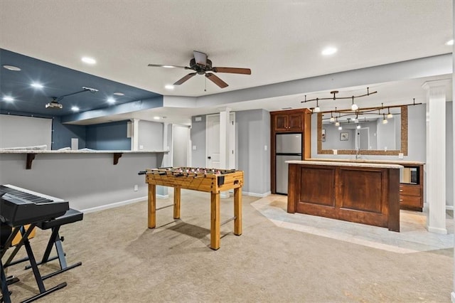 12544 Grand Ct, Kansas City, MO 64145 - recreation room with a ceiling fan, a textured ceiling, light carpet, baseboards, and recessed lighting