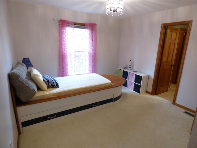 2405 W 123rd Ter, Leawood, KS 66209 - bedroom with light carpet, visible vents, and an inviting chandelier