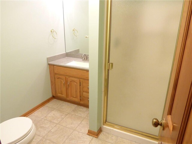 2405 W 123rd Ter, Leawood, KS 66209 - full bathroom with baseboards, toilet, vanity, and a stall shower