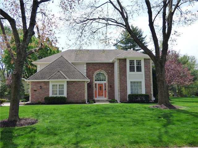 2405 W 123rd Ter, Leawood, KS 66209 - view of front of property with a shingled roof, a front lawn, and brick siding