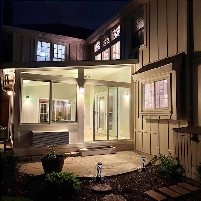 2405 W 123rd Ter, Leawood, KS 66209 - rear view of house featuring board and batten siding and a balcony