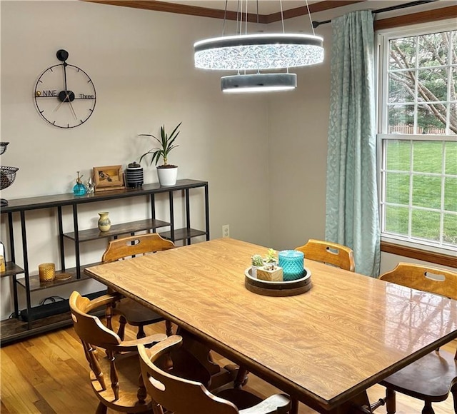 2405 W 123rd Ter, Leawood, KS 66209 - dining room featuring plenty of natural light, wood finished floors, and ornamental molding