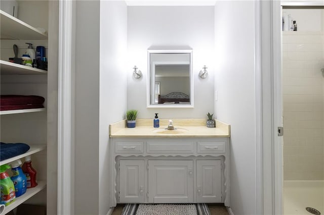 bathroom with vanity and a stall shower