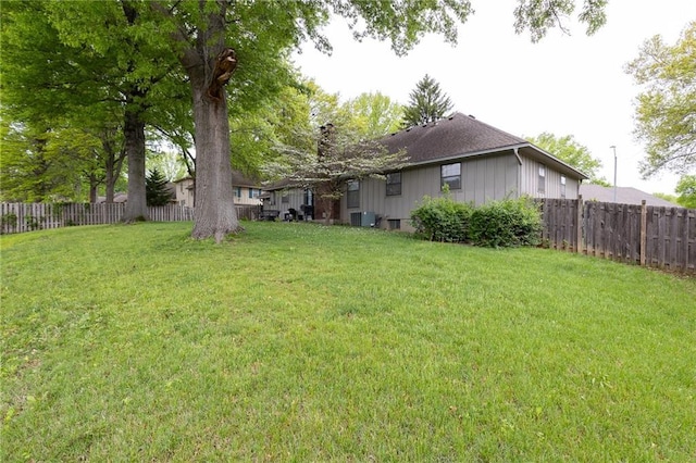 view of yard featuring a fenced backyard and cooling unit