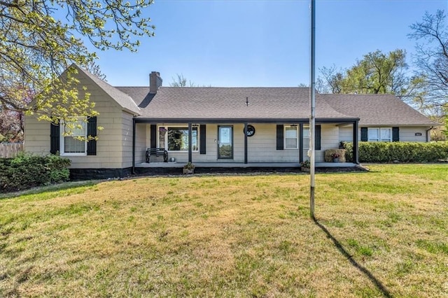 9501 Wornall Rd, Kansas City, MO 64114 - rear view of property with a lawn, a chimney, and roof with shingles