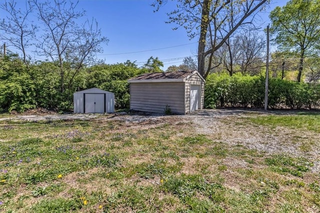 9501 Wornall Rd, Kansas City, MO 64114 - view of yard featuring an outbuilding and a storage shed