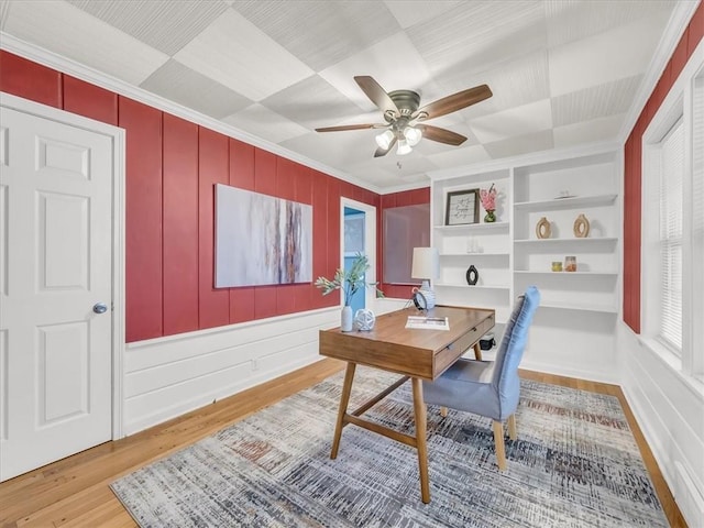 9501 Wornall Rd, Kansas City, MO 64114 - office area featuring crown molding, wood finished floors, a ceiling fan, and built in shelves