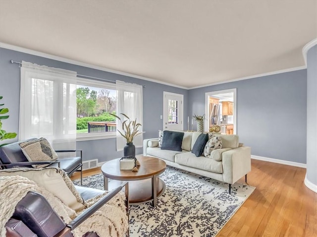 9501 Wornall Rd, Kansas City, MO 64114 - living area featuring baseboards, ornamental molding, and visible vents