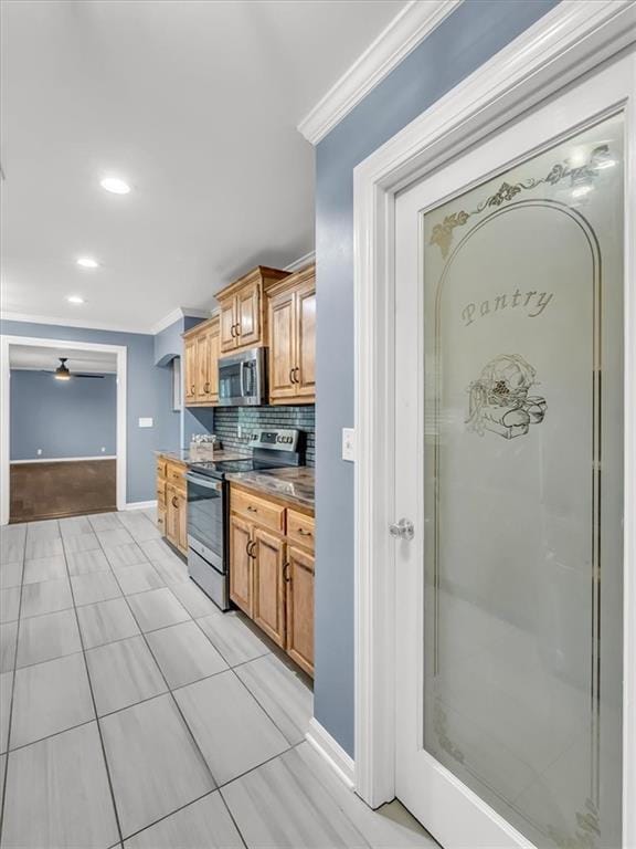 9501 Wornall Rd, Kansas City, MO 64114 - kitchen featuring baseboards, recessed lighting, backsplash, crown molding, and appliances with stainless steel finishes