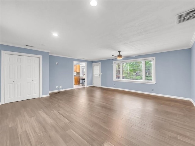 9501 Wornall Rd, Kansas City, MO 64114 - unfurnished living room with wood finished floors, a ceiling fan, baseboards, and ornamental molding