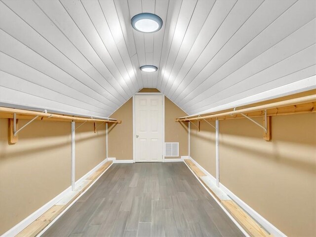 9501 Wornall Rd, Kansas City, MO 64114 - spacious closet featuring wood finished floors, visible vents, and vaulted ceiling