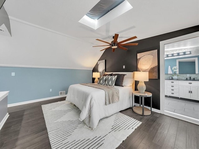 9501 Wornall Rd, Kansas City, MO 64114 - bedroom with vaulted ceiling with skylight, ceiling fan, baseboards, dark wood-style flooring, and visible vents