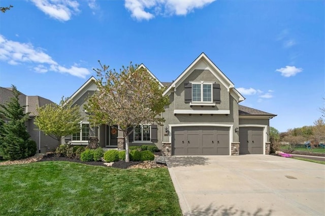 craftsman house featuring concrete driveway, stone siding, a front yard, a garage, and stucco siding