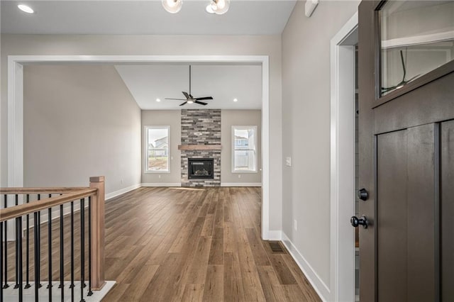 25016 W 89th Ter, Lenexa, KS 66227 - entryway with ceiling fan, wood finished floors, and a stone fireplace