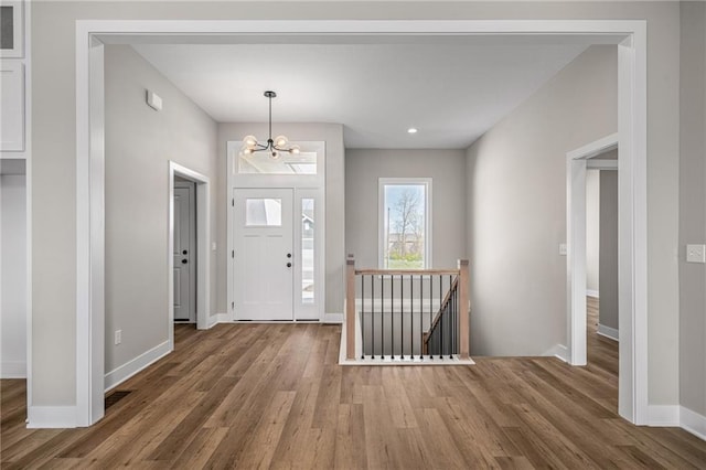 25016 W 89th Ter, Lenexa, KS 66227 - foyer with wood finished floors, a chandelier, and recessed lighting