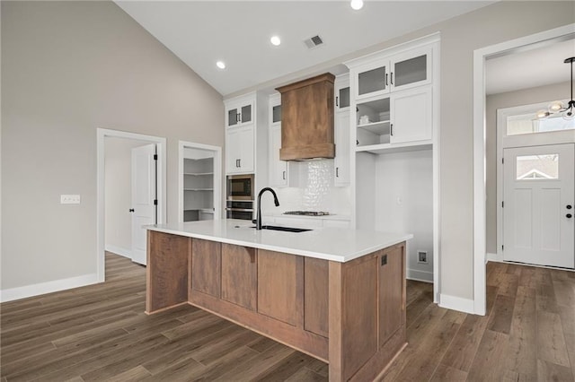 25016 W 89th Ter, Lenexa, KS 66227 - kitchen featuring stainless steel appliances, dark wood-style floors, white cabinets, a kitchen island with sink, and recessed lighting