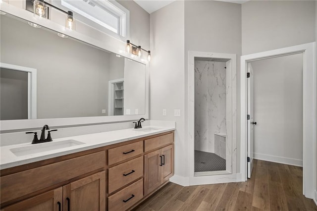 25016 W 89th Ter, Lenexa, KS 66227 - full bath featuring a marble finish shower, double vanity, and wood finished floors