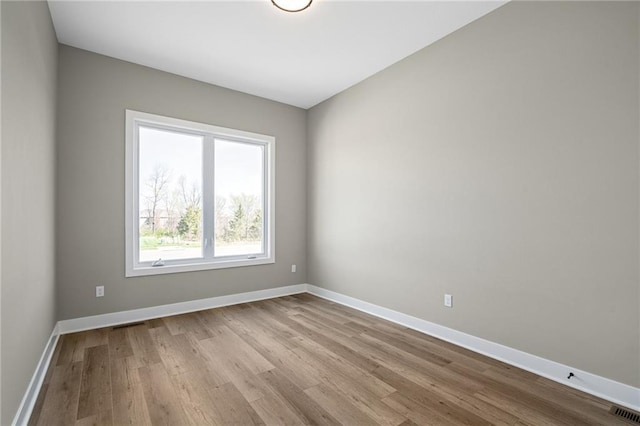 25016 W 89th Ter, Lenexa, KS 66227 - spare room featuring wood finished floors and baseboards