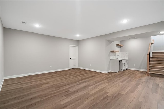 25016 W 89th Ter, Lenexa, KS 66227 - finished basement with wood finished floors, stairs, and recessed lighting