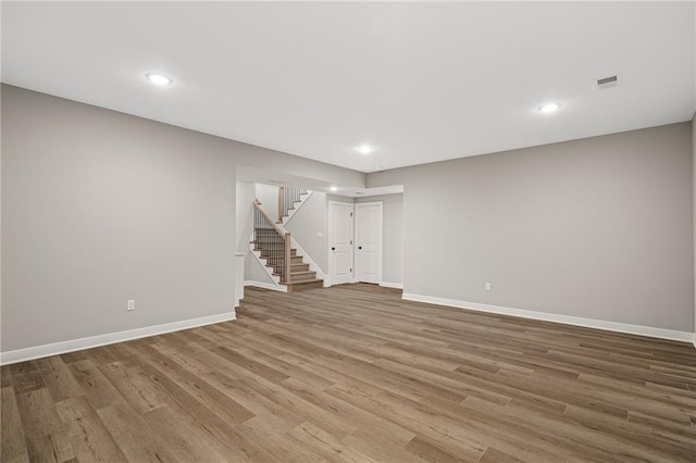 25016 W 89th Ter, Lenexa, KS 66227 - empty room featuring stairs, wood finished floors, and recessed lighting