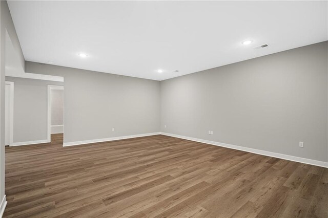 25016 W 89th Ter, Lenexa, KS 66227 - unfurnished room with wood finished floors and recessed lighting