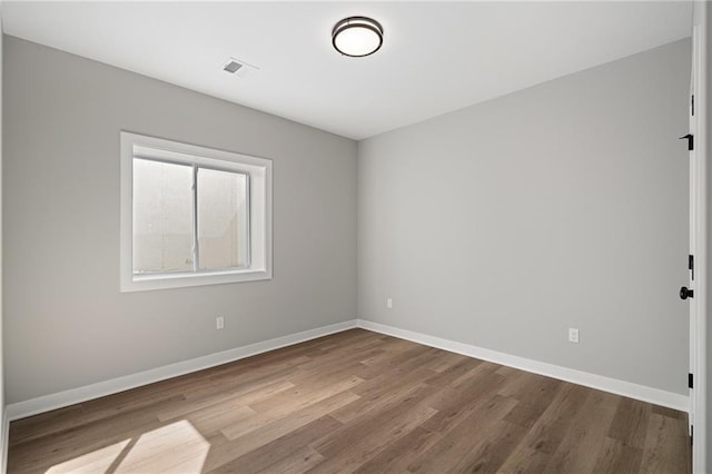 25016 W 89th Ter, Lenexa, KS 66227 - empty room featuring wood finished floors and baseboards