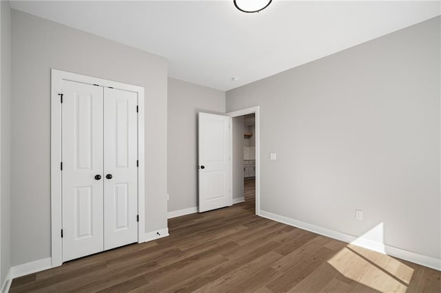 25016 W 89th Ter, Lenexa, KS 66227 - unfurnished bedroom featuring wood finished floors and a closet