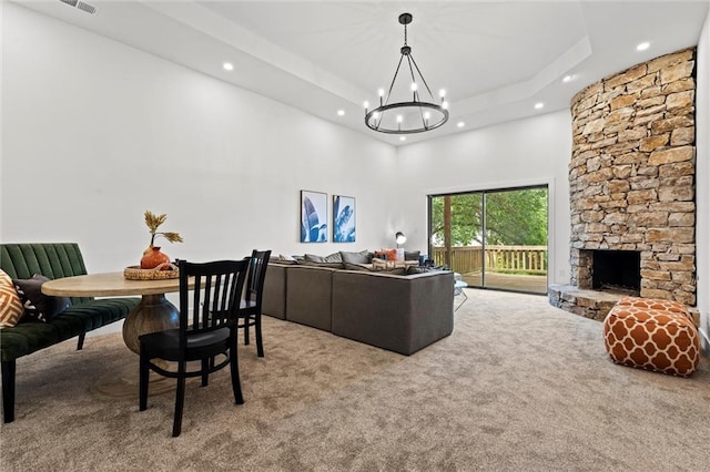 224 NW Locust St, Lees Summit, MO 64064 - dining area with a high ceiling, carpet flooring, a chandelier, recessed lighting, and a raised ceiling