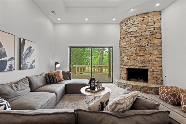 224 NW Locust St, Lees Summit, MO 64064 - living area featuring recessed lighting, a towering ceiling, carpet floors, and a stone fireplace