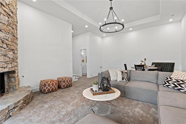 224 NW Locust St, Lees Summit, MO 64064 - living area featuring carpet flooring, a chandelier, recessed lighting, a fireplace, and a raised ceiling
