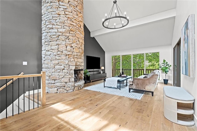 224 NW Locust St, Lees Summit, MO 64064 - living area with wood finished floors, a chandelier, beamed ceiling, and high vaulted ceiling