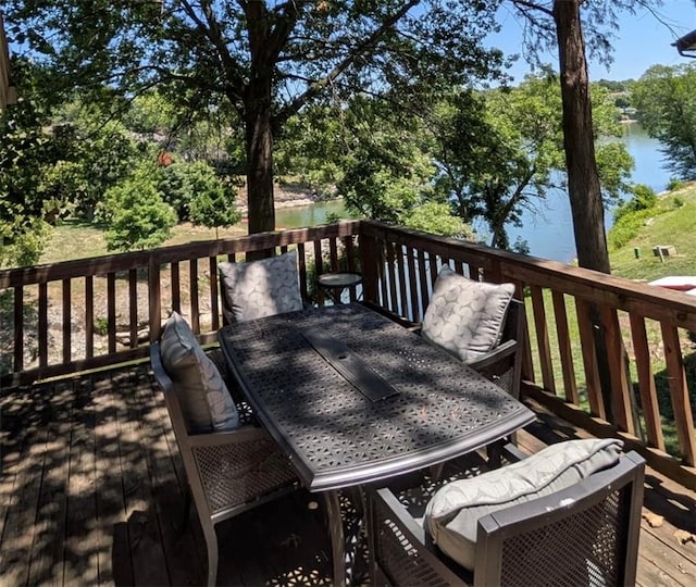 224 NW Locust St, Lees Summit, MO 64064 - wooden deck featuring outdoor dining space and a water view