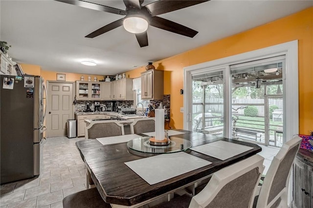 653 NE Reed Xing, Lees Summit, MO 64086 - dining space with a ceiling fan and a healthy amount of sunlight