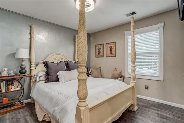 653 NE Reed Xing, Lees Summit, MO 64086 - bedroom featuring baseboards, wood finished floors, and visible vents