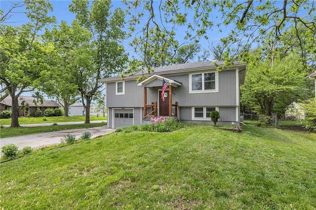bi-level home featuring driveway and an attached garage