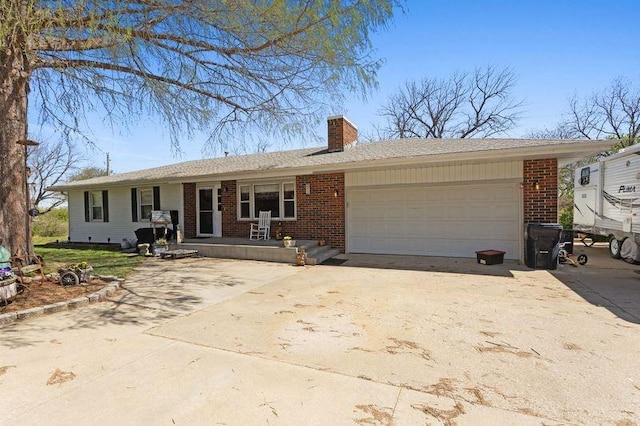 108 Sunrise Ct, Ozawkie, KS 66070 - single story home with brick siding, an attached garage, a chimney, and concrete driveway