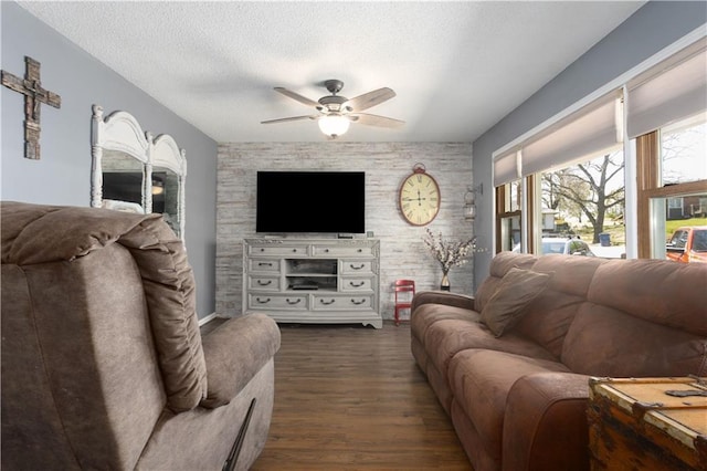 108 Sunrise Ct, Ozawkie, KS 66070 - living area featuring a textured ceiling, dark wood-type flooring, and ceiling fan